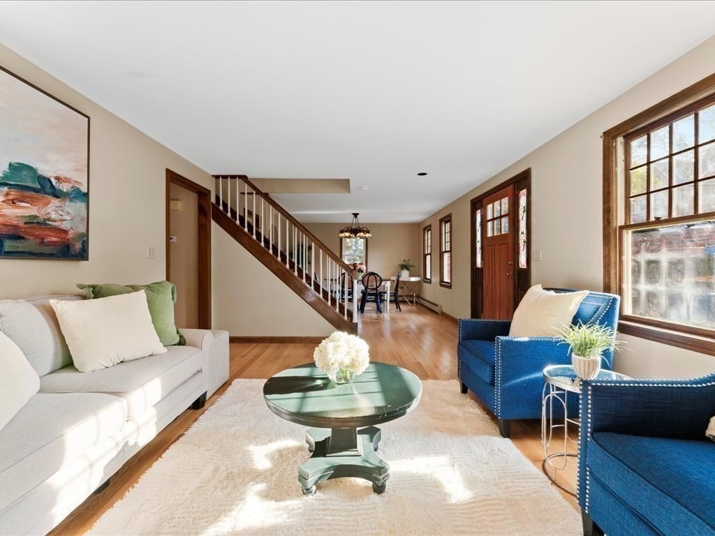 a living room with furniture and a table