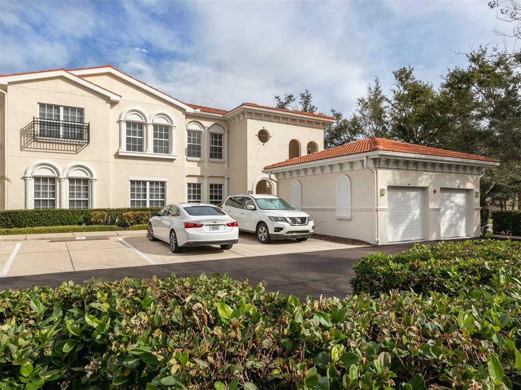 a view of multiple house with garage and sitting area