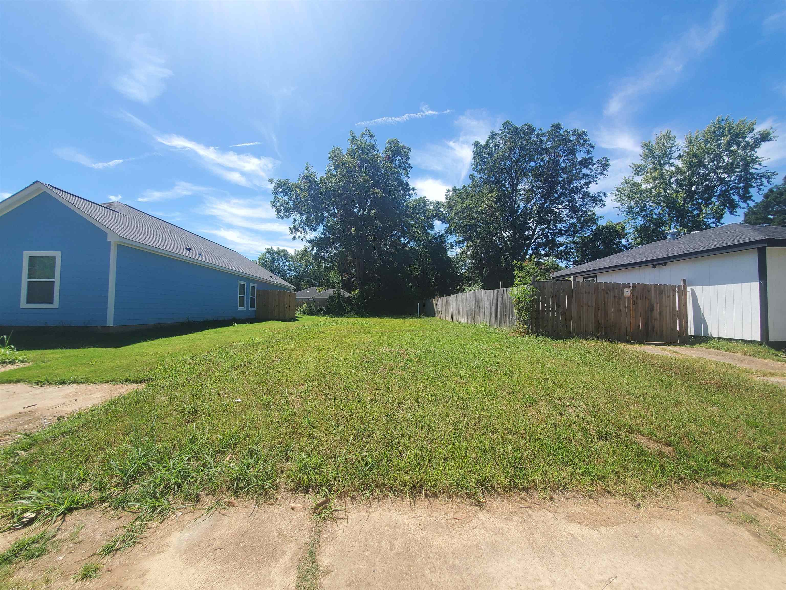 a view of a backyard with a garden