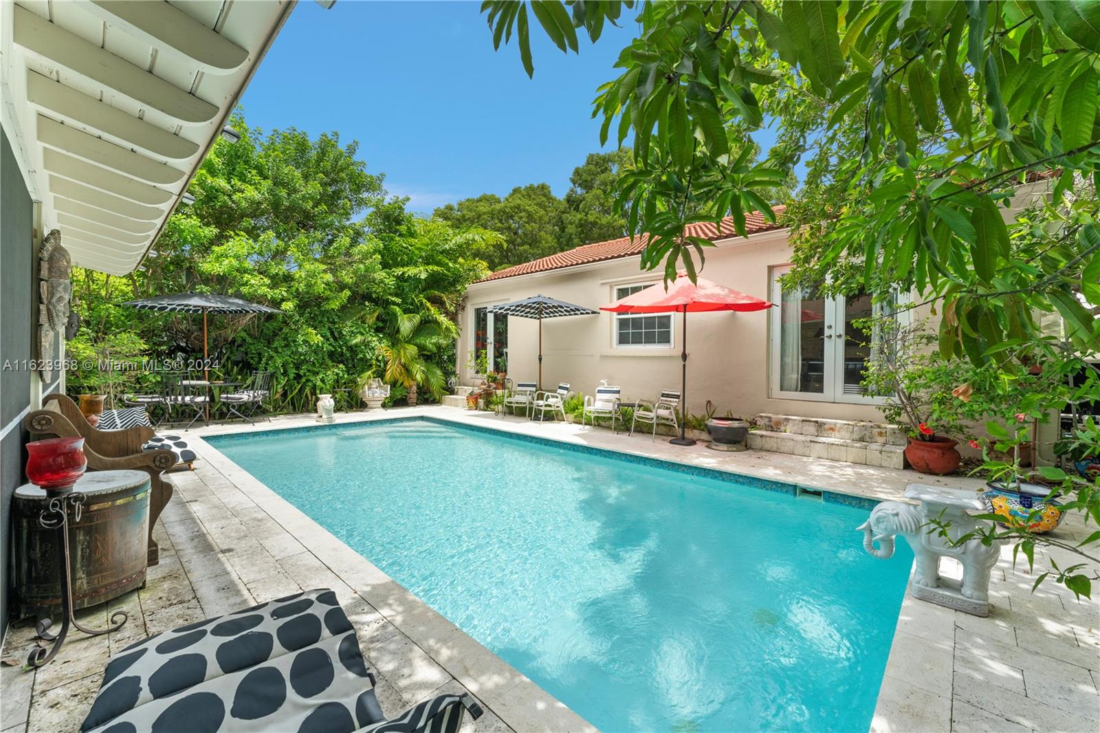 a front view of house with yard and outdoor seating