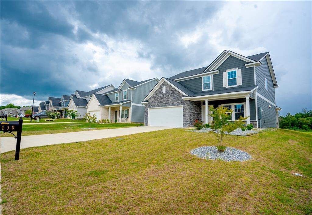 a front view of a house with a yard