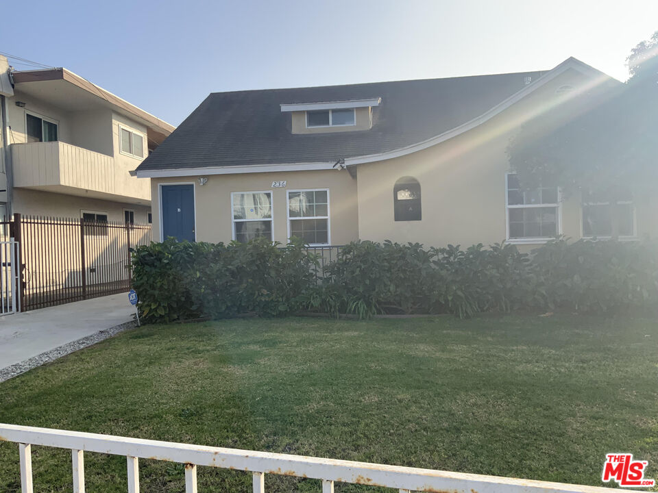 a house view with a garden space