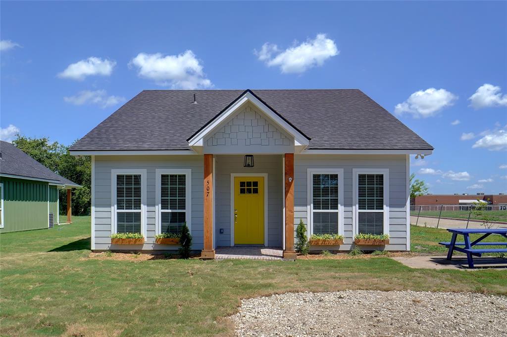 a view of a house with outdoor space and garden