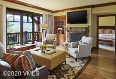 a living room with fireplace furniture and a flat screen tv