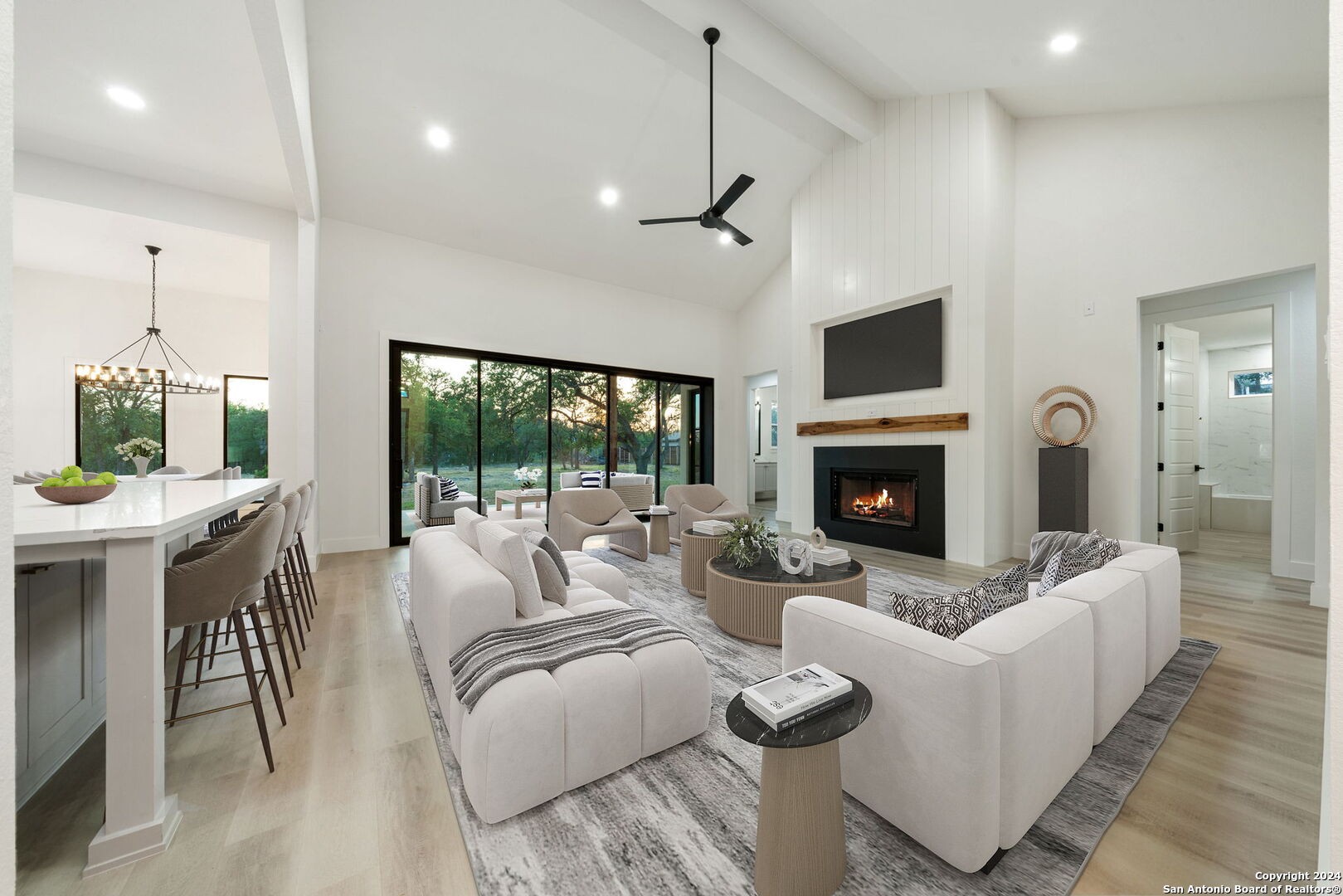 a living room with furniture fireplace and a flat screen tv