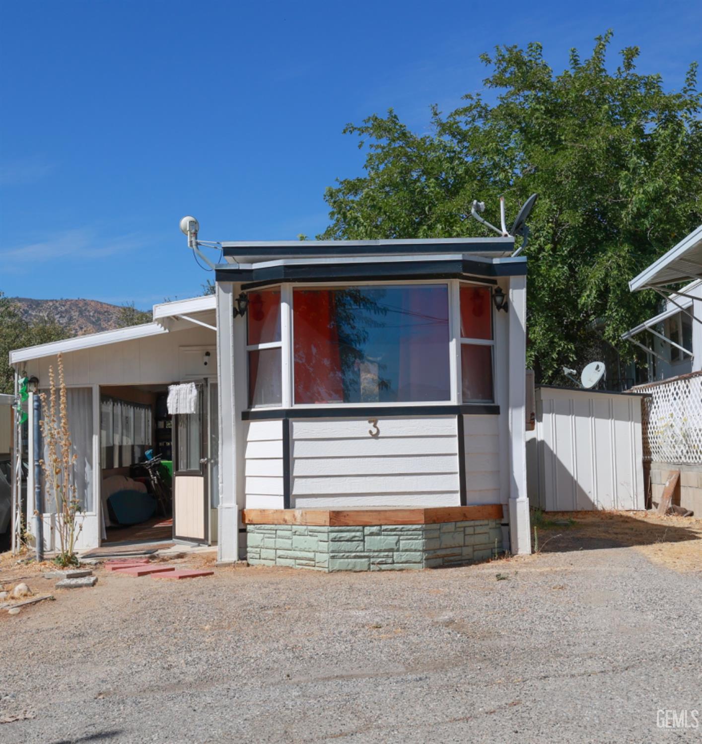 a view of house with tree s