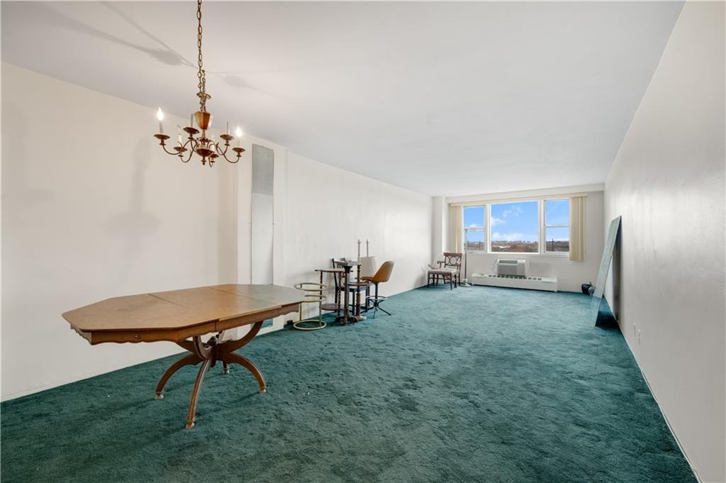 a view of a room with furniture and a chandelier