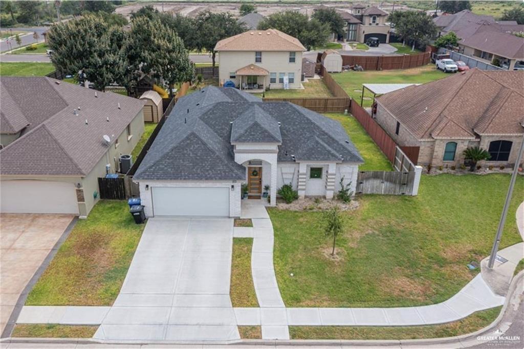 an aerial view of a house with swimming pool