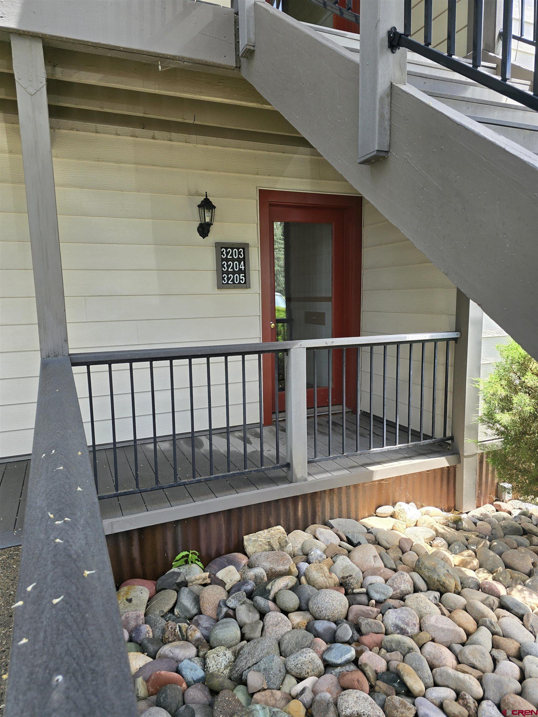 a view of balcony with wooden floor