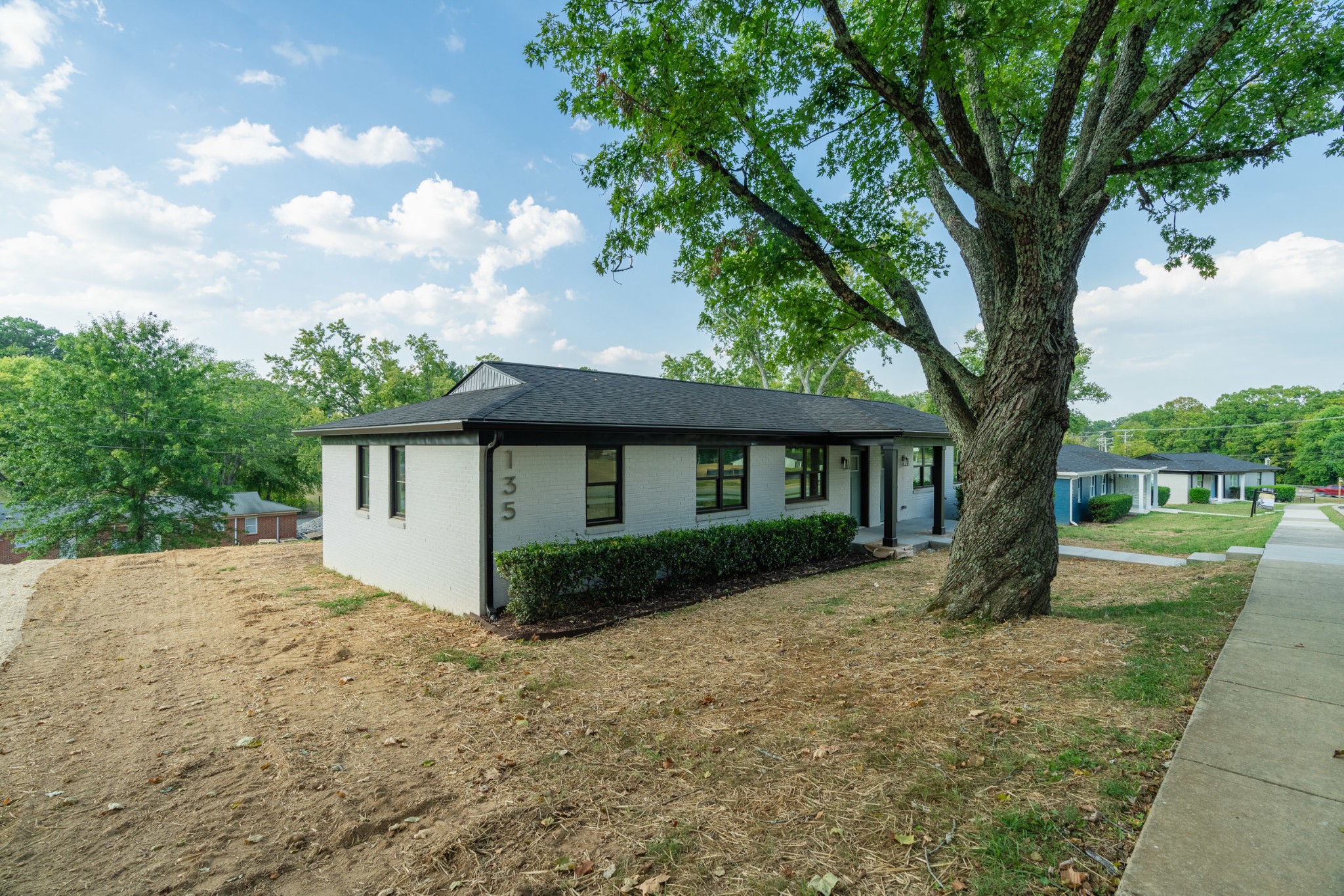 a view of a house with a yard