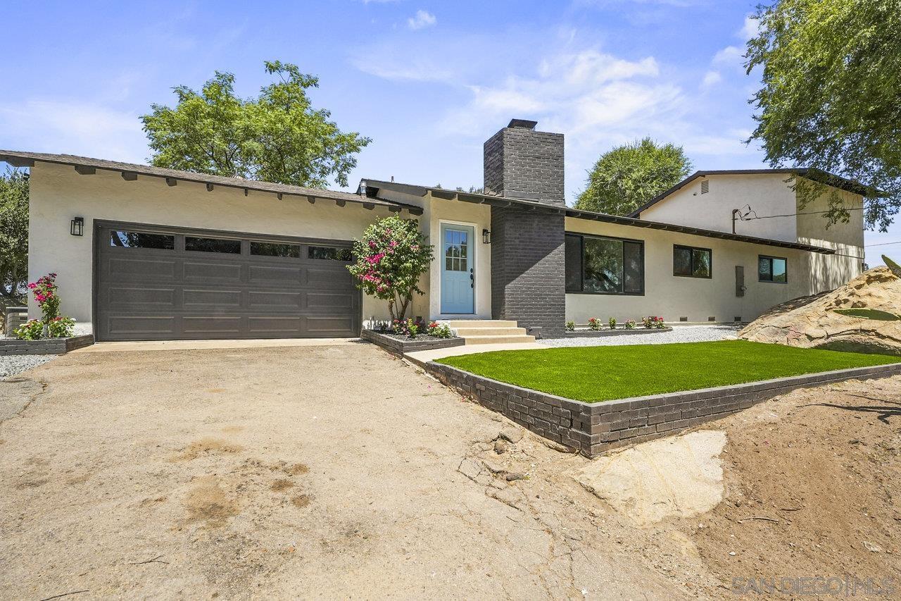 a front view of a house with yard