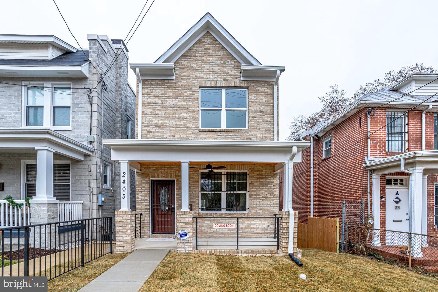 front view of a house with a yard