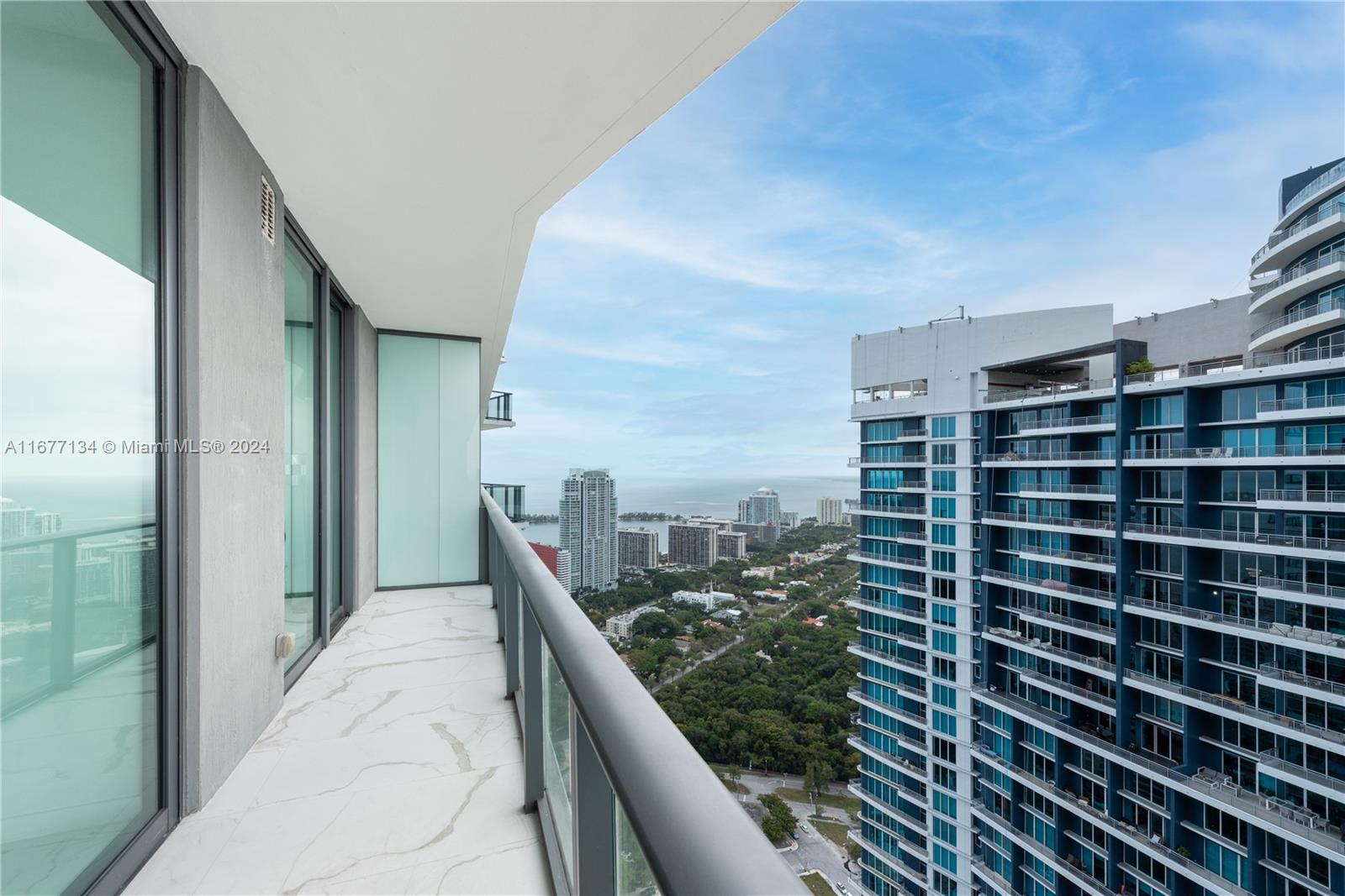 a view of balcony with a floor to ceiling window and stairs