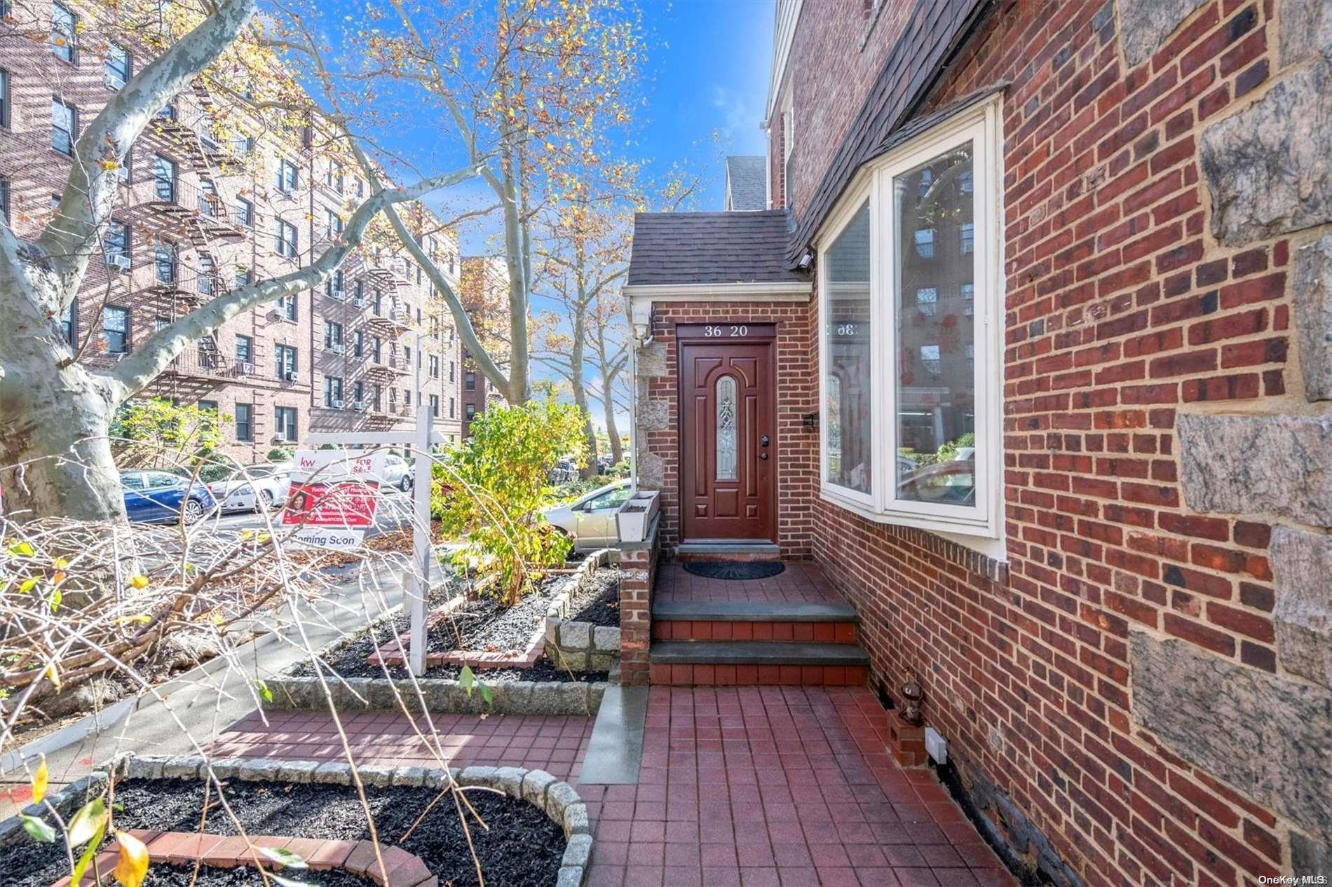 a view of a house with brick walls