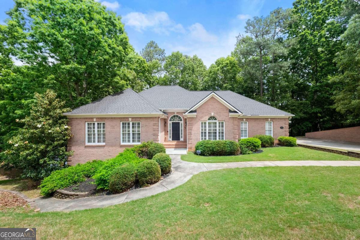 a front view of a house with a yard