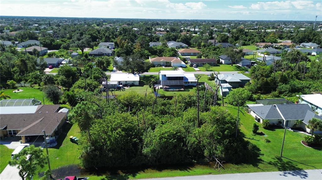 an aerial view of a house with lots of trees