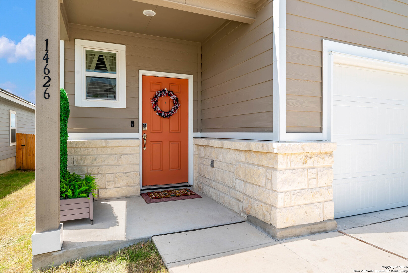 a front view of a house with a garage