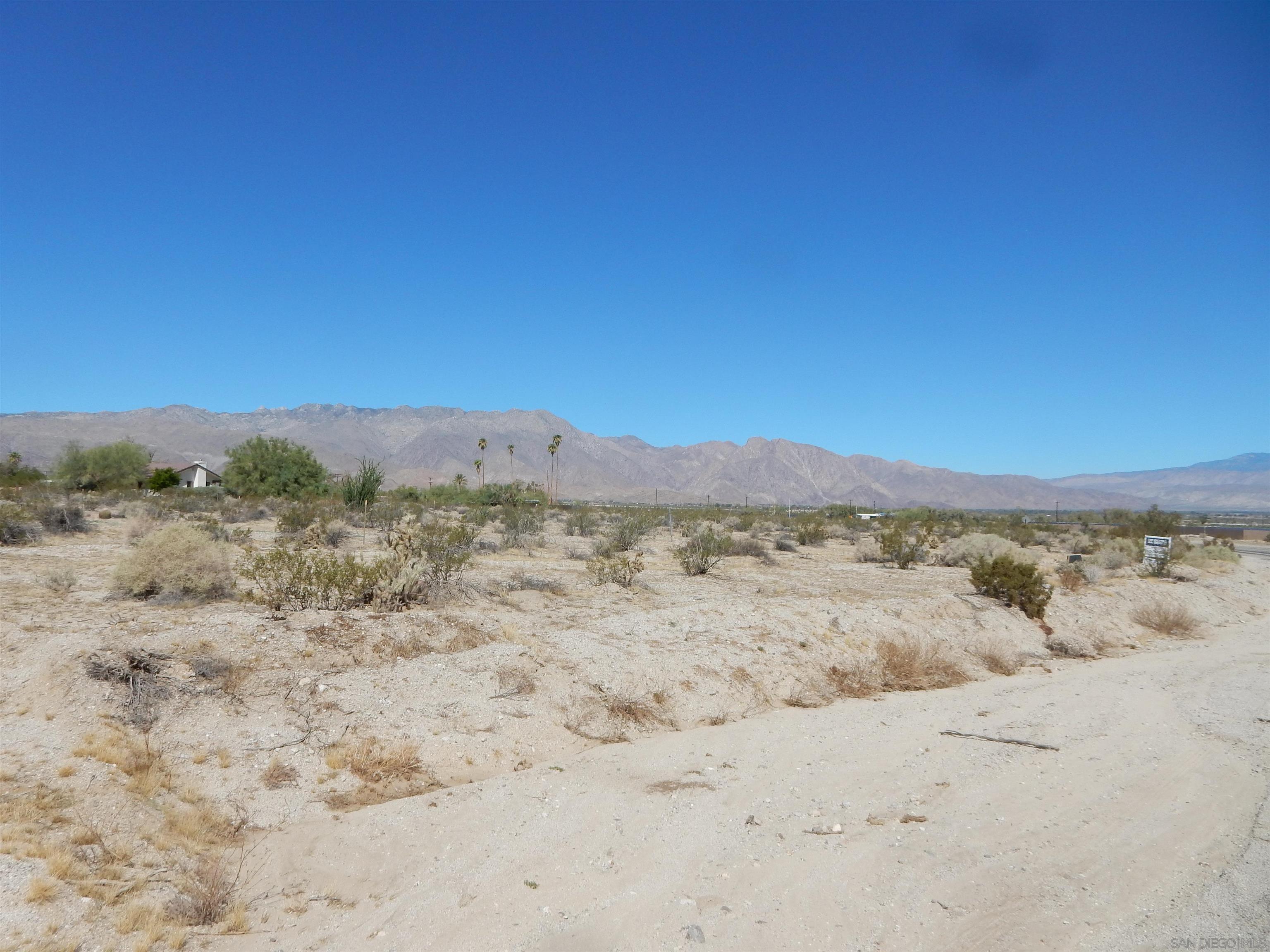 a view of a beach with a mountain view