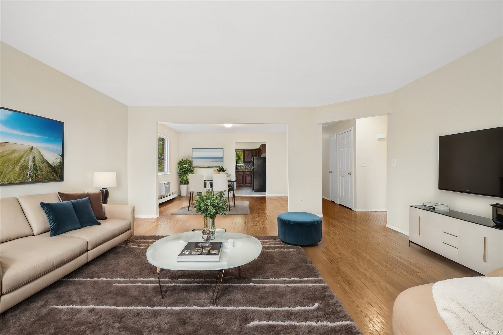 a living room with furniture and a flat screen tv