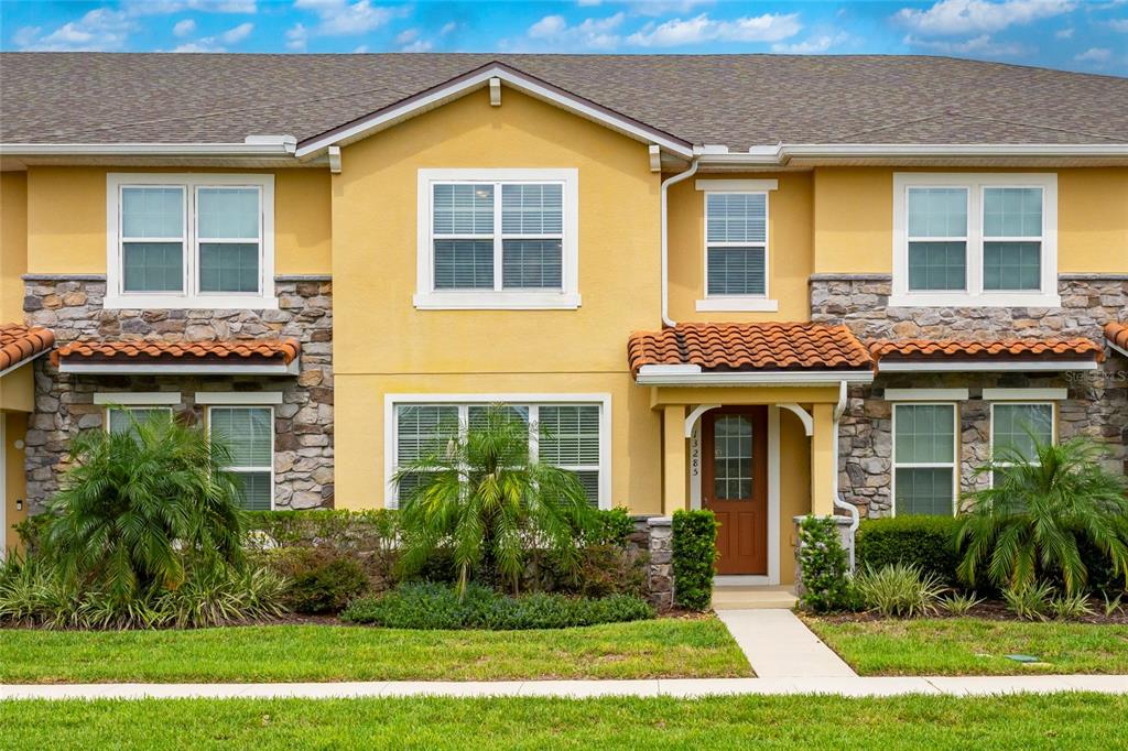 a front view of a house having yard