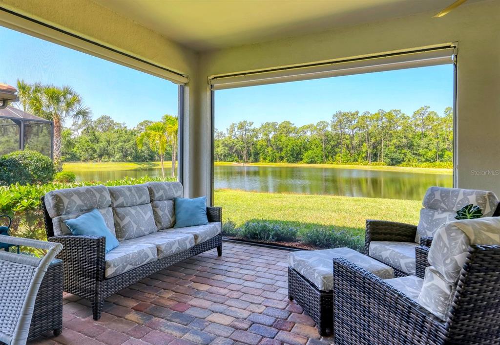 a balcony with furniture and a garden