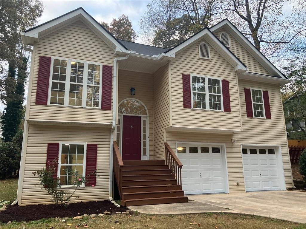 a front view of a house with a garage