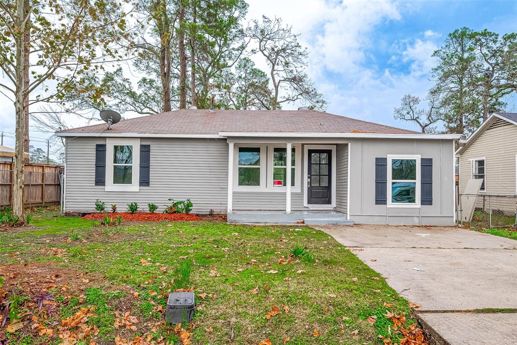 front view of a house with a yard