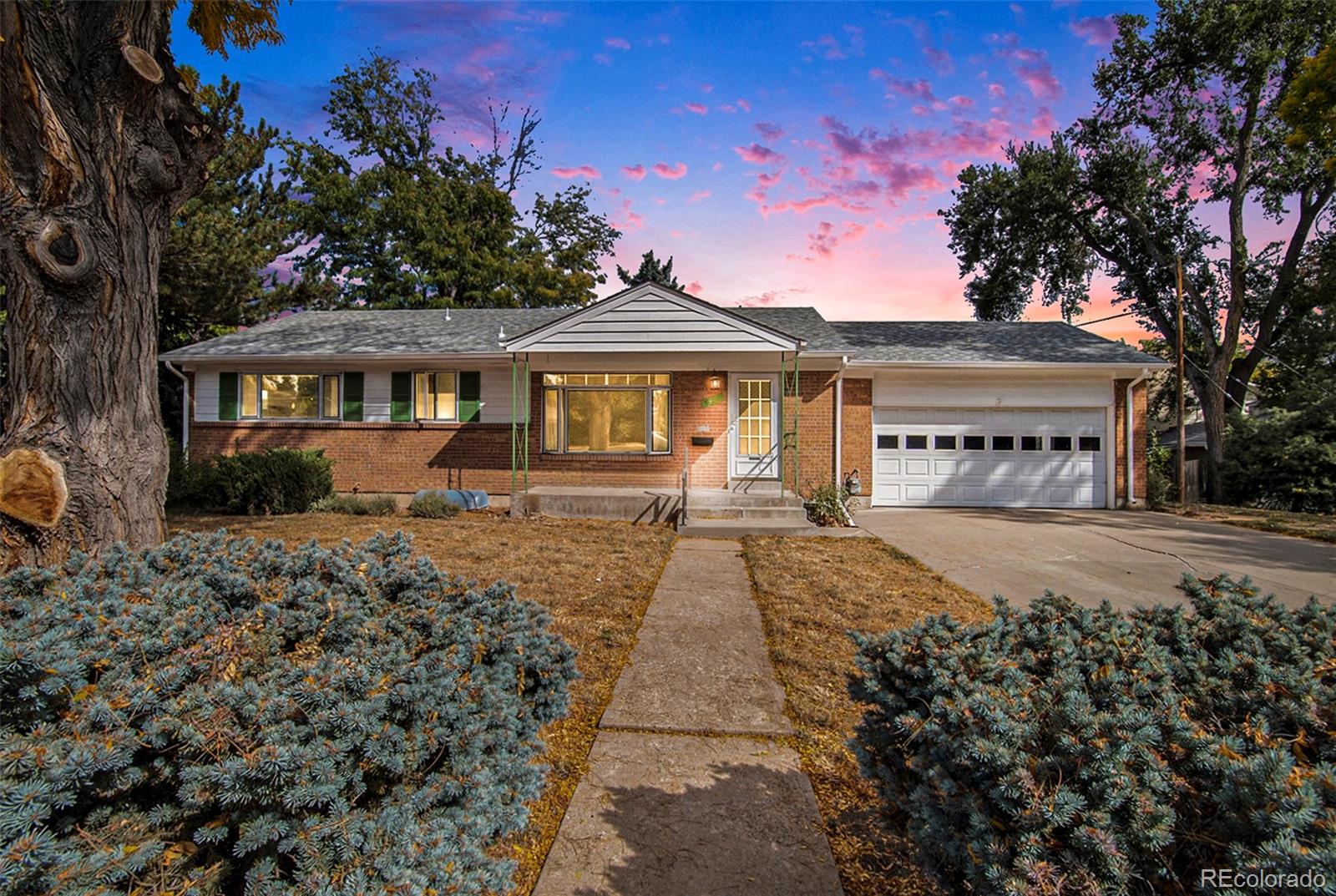 front view of a house with a yard