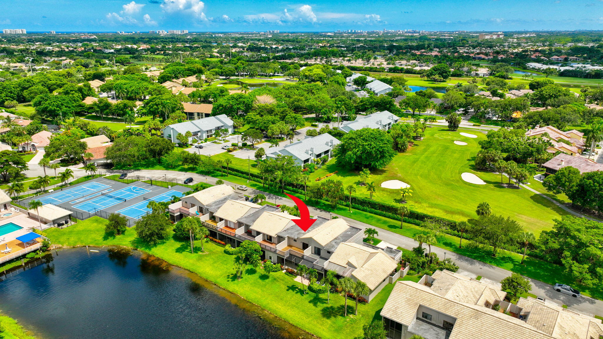 an aerial view of residential houses with outdoor space and street view