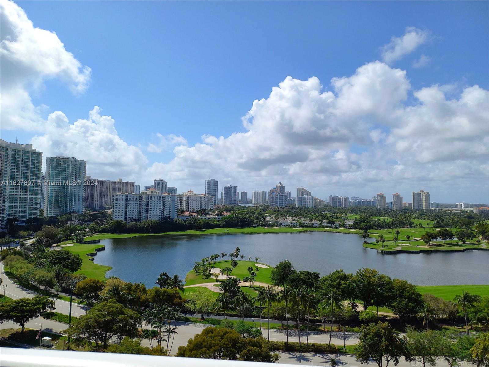 a view of a lake with a city