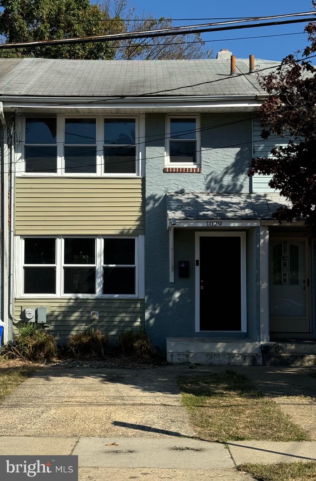 a front view of a house with garage