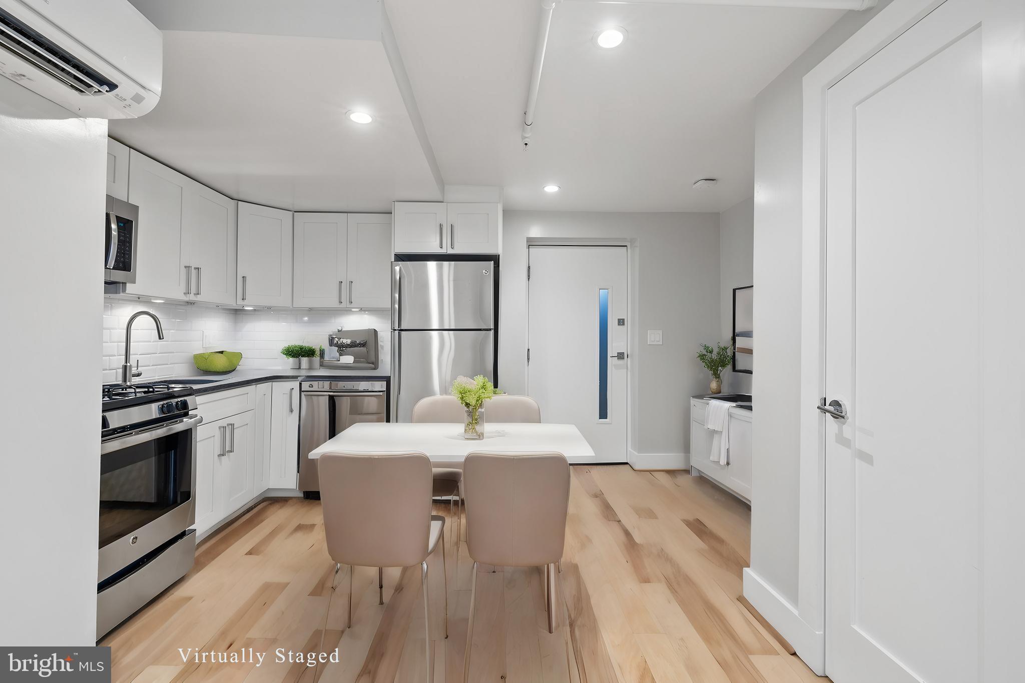 a kitchen with a sink appliances and cabinets