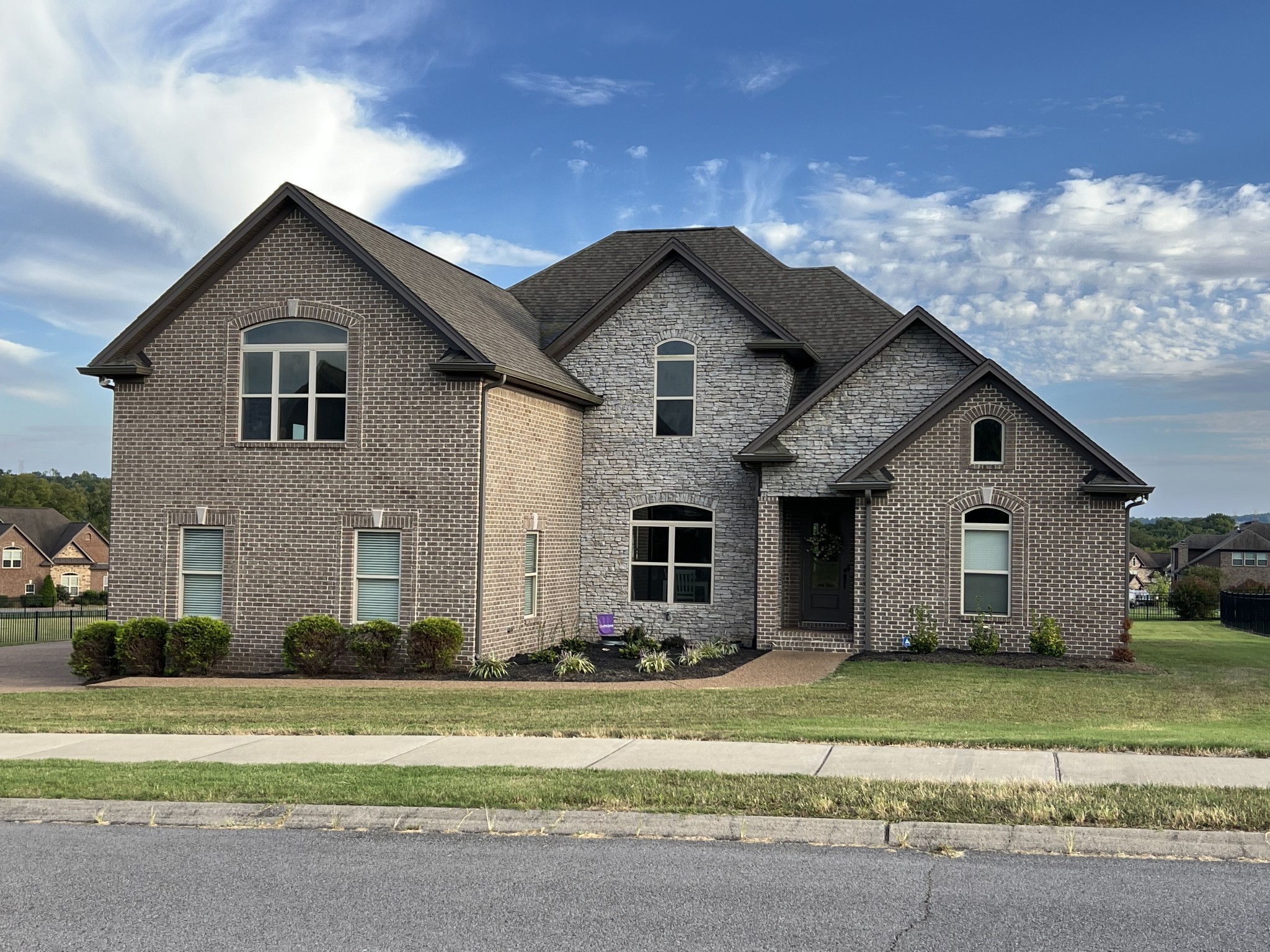 a front view of a house with a yard