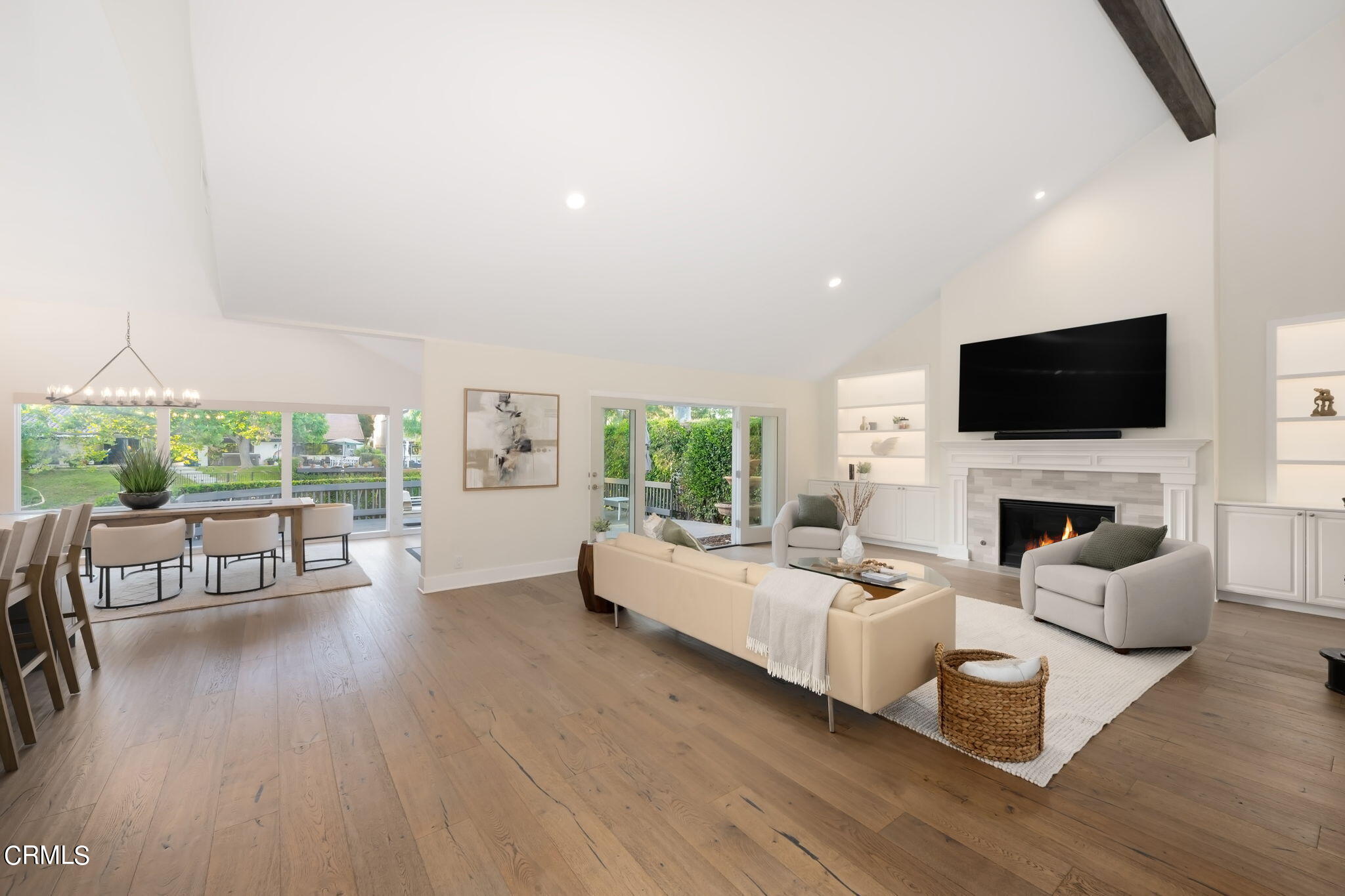 a living room with fireplace furniture and a flat screen tv