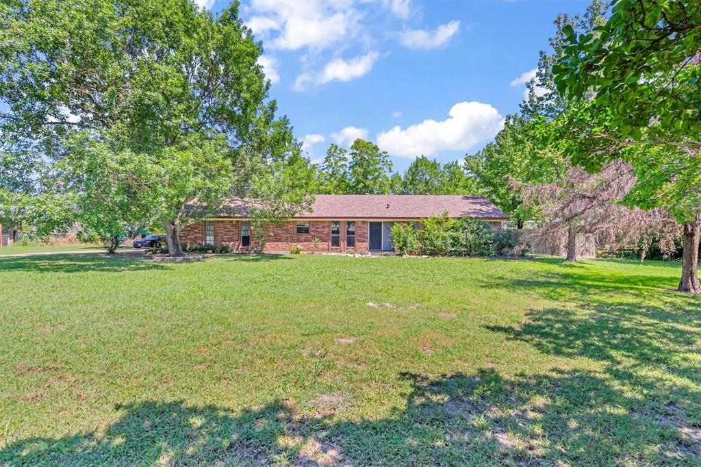 a view of a house with a big yard