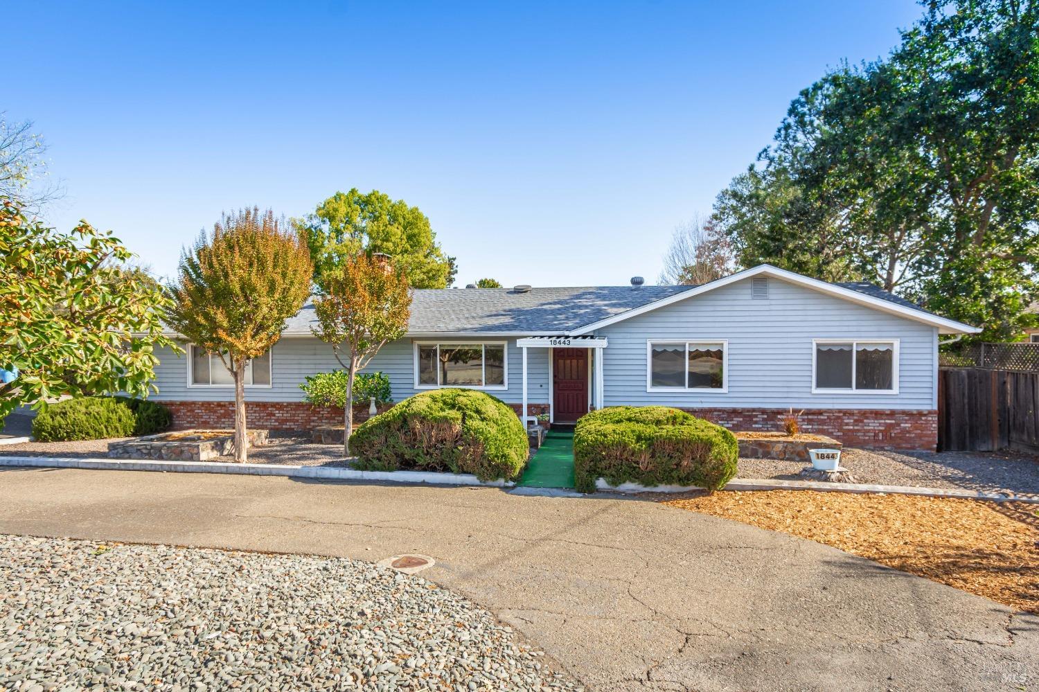 a view of a house with a yard