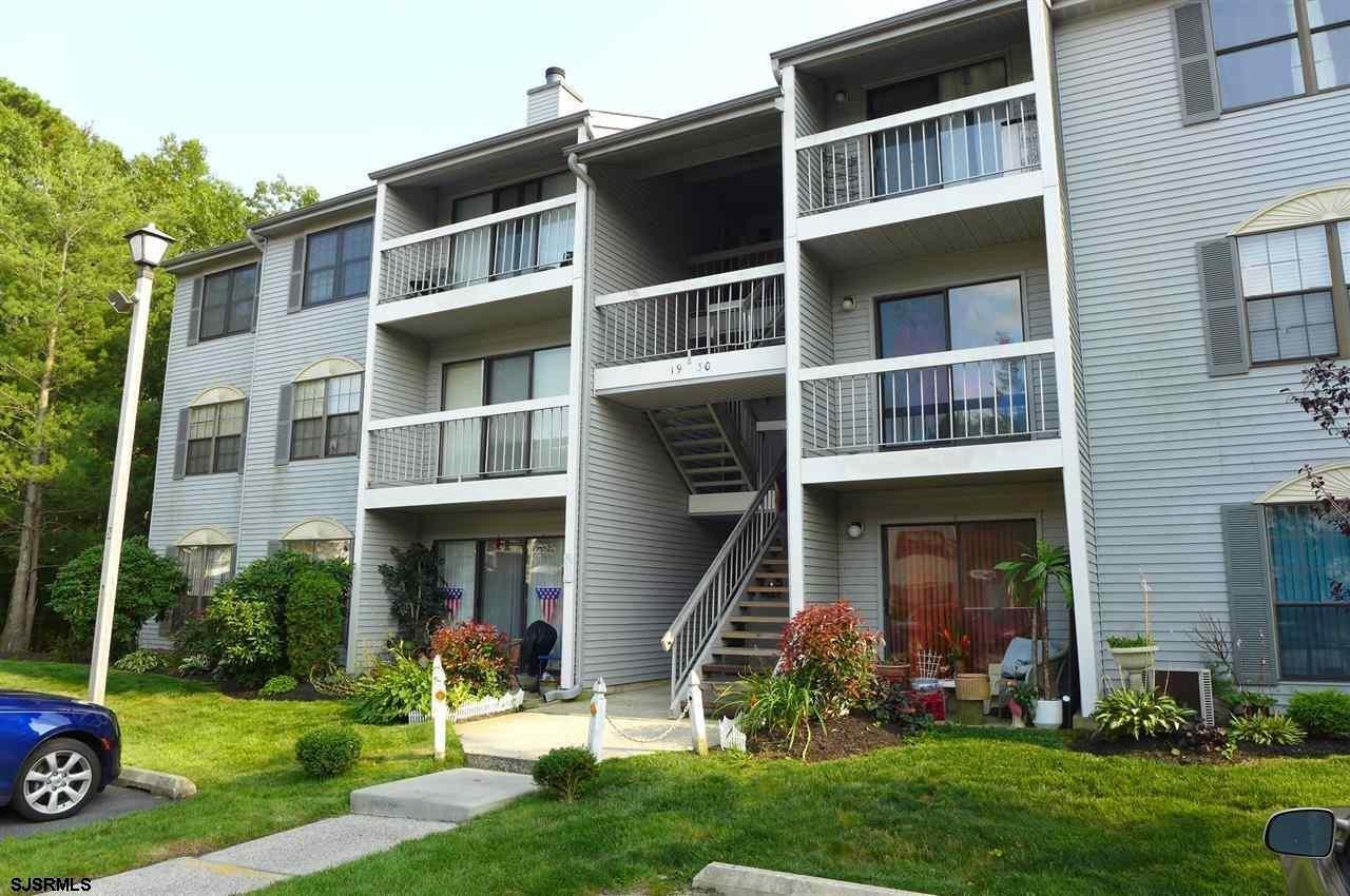 a view of a brick building with a yard