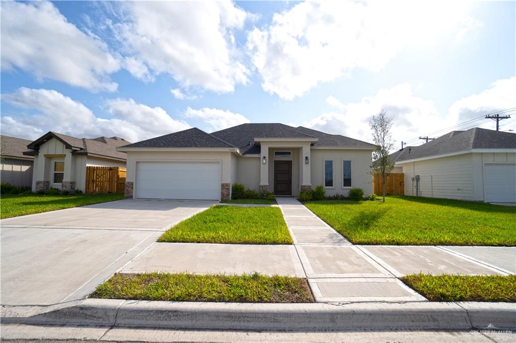 a view of front a house with a yard