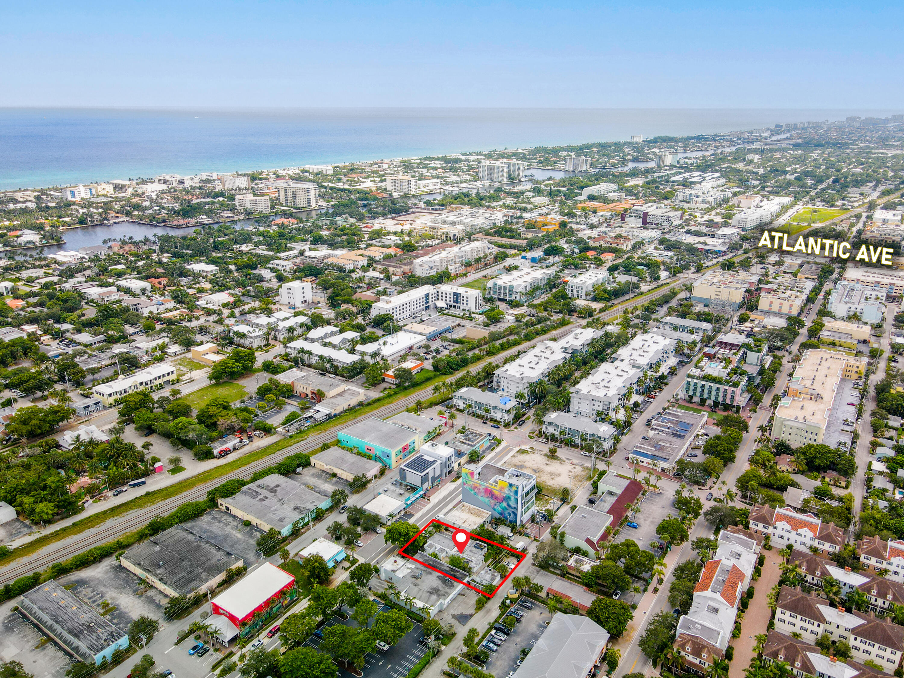 an aerial view of residential building and lake