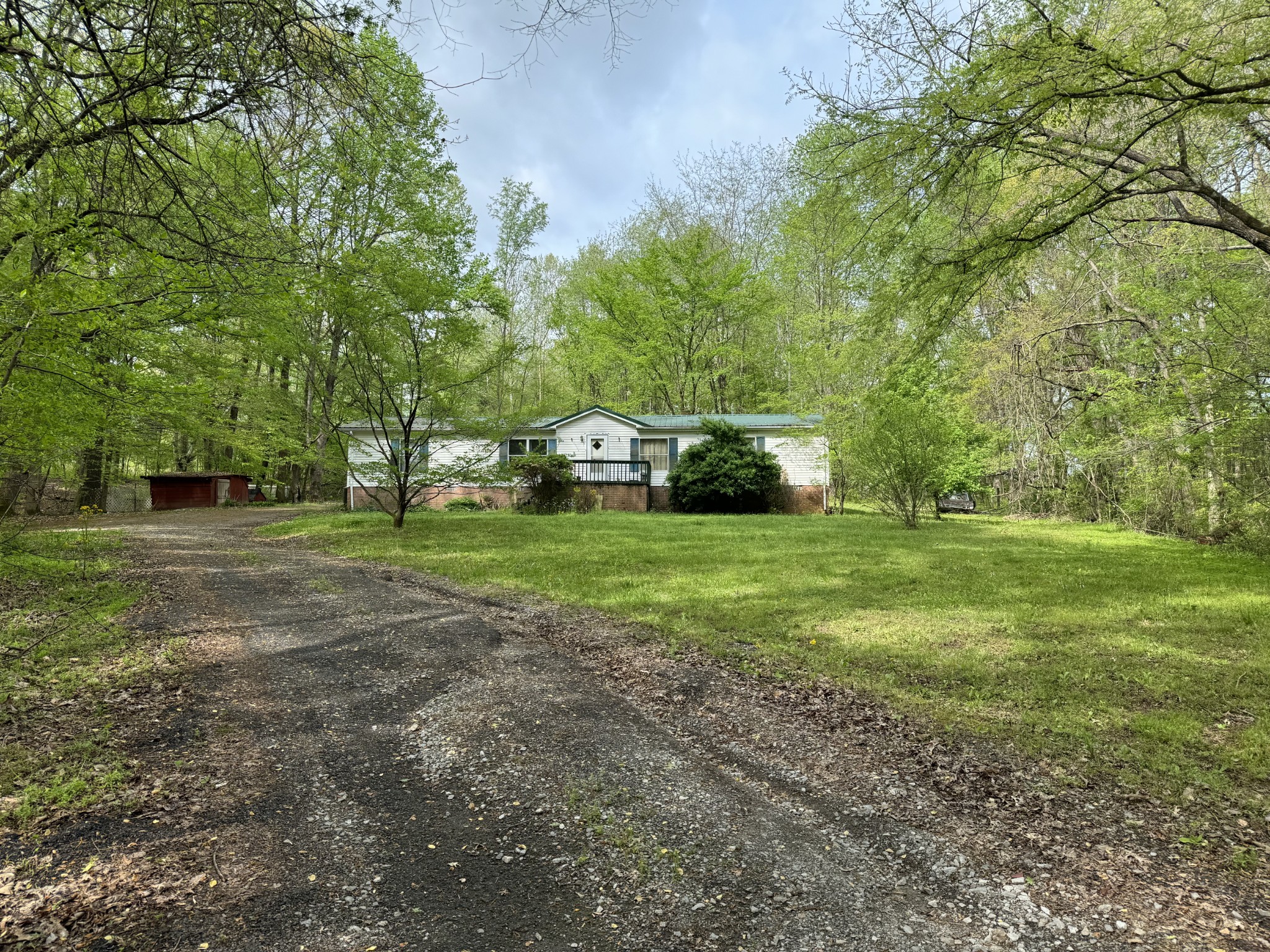 a view of a tree in front of a house