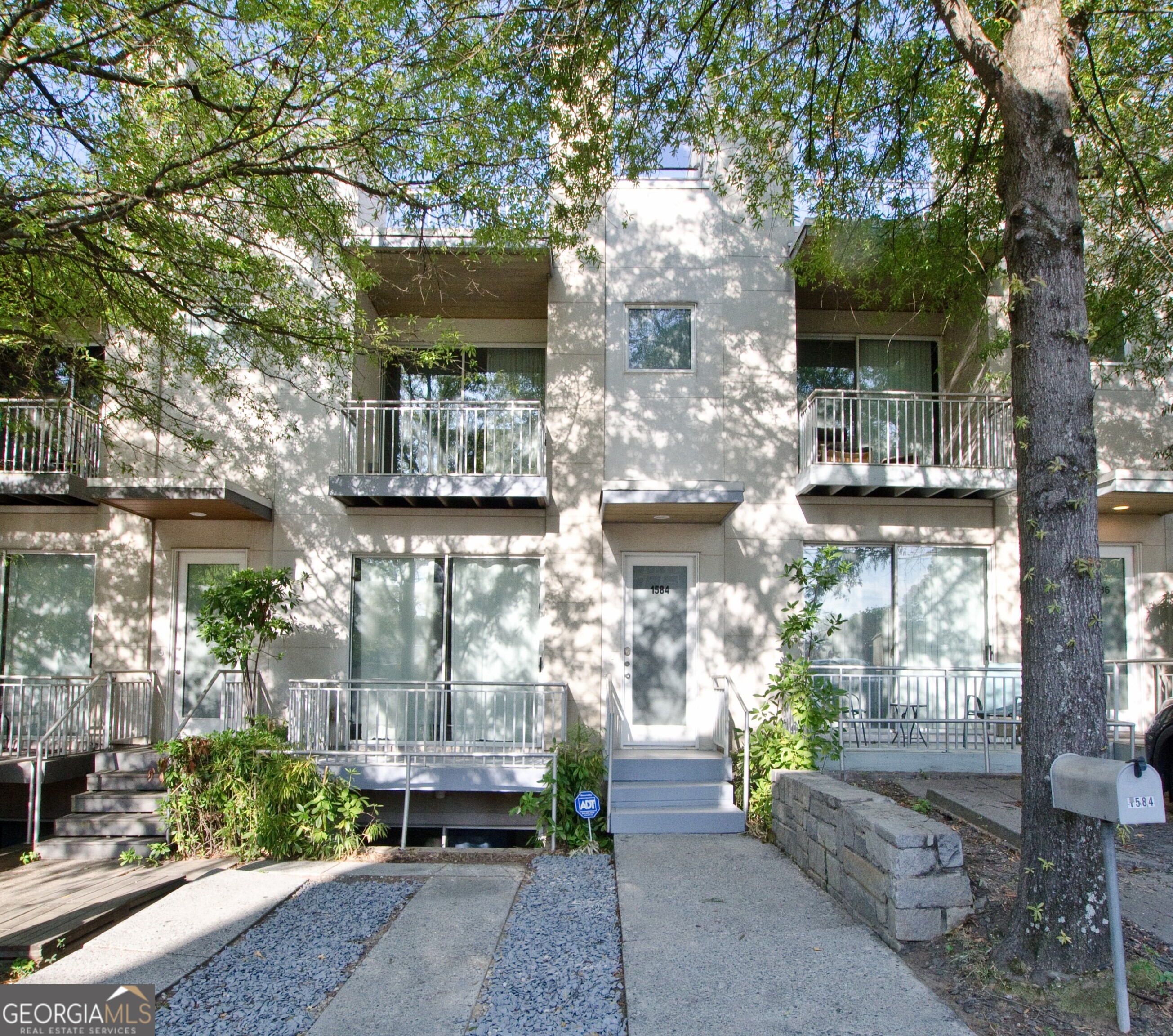 a front view of a house with outdoor space