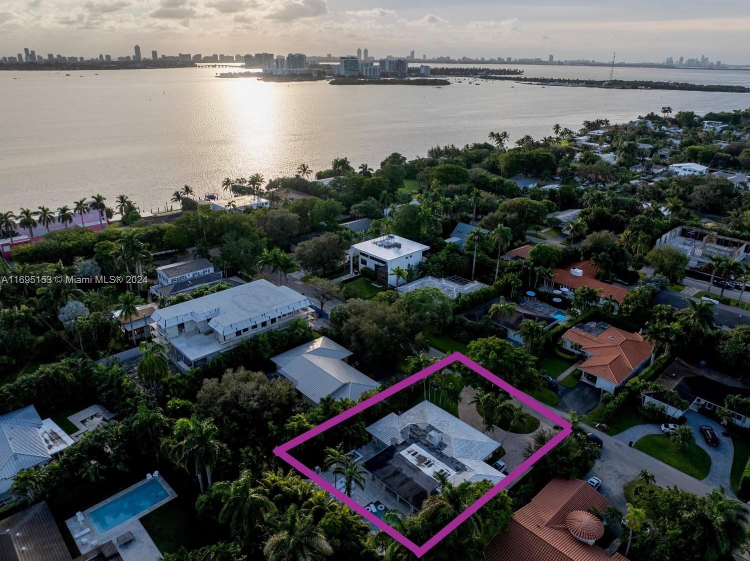 an aerial view of residential house with outdoor space and lake view