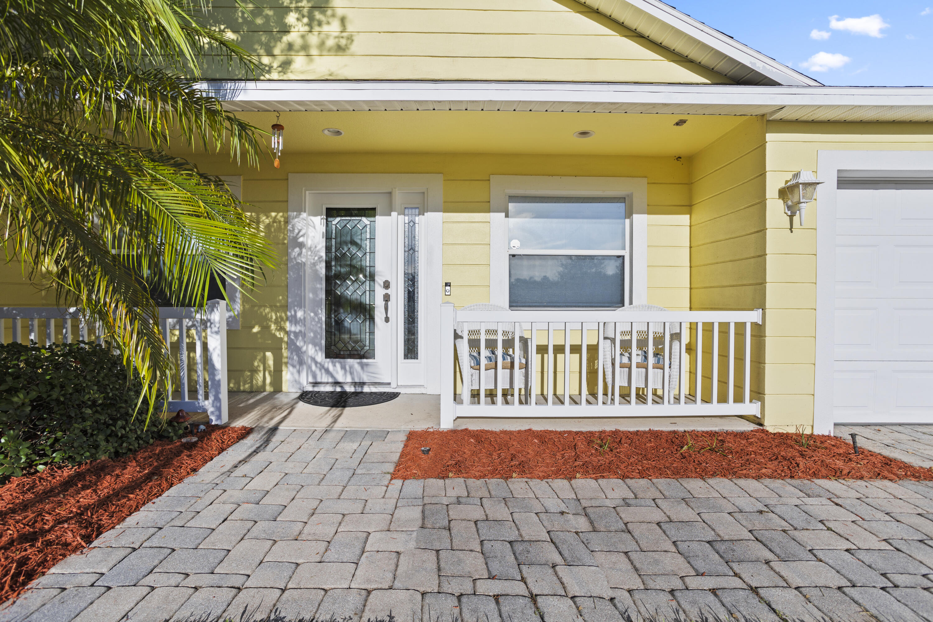 a front view of a house with a outdoor seating