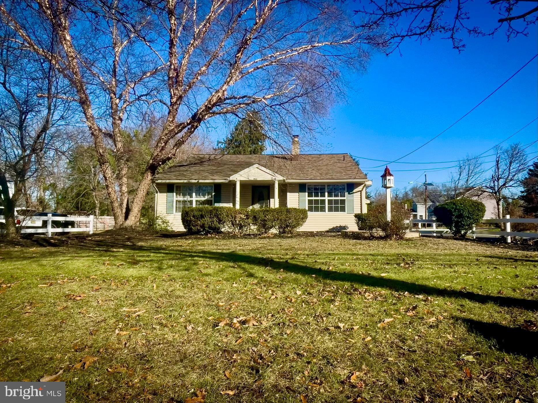 a front view of a house with a yard table and chairs