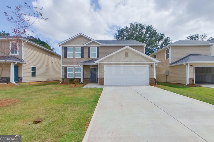 front view of a house with a yard