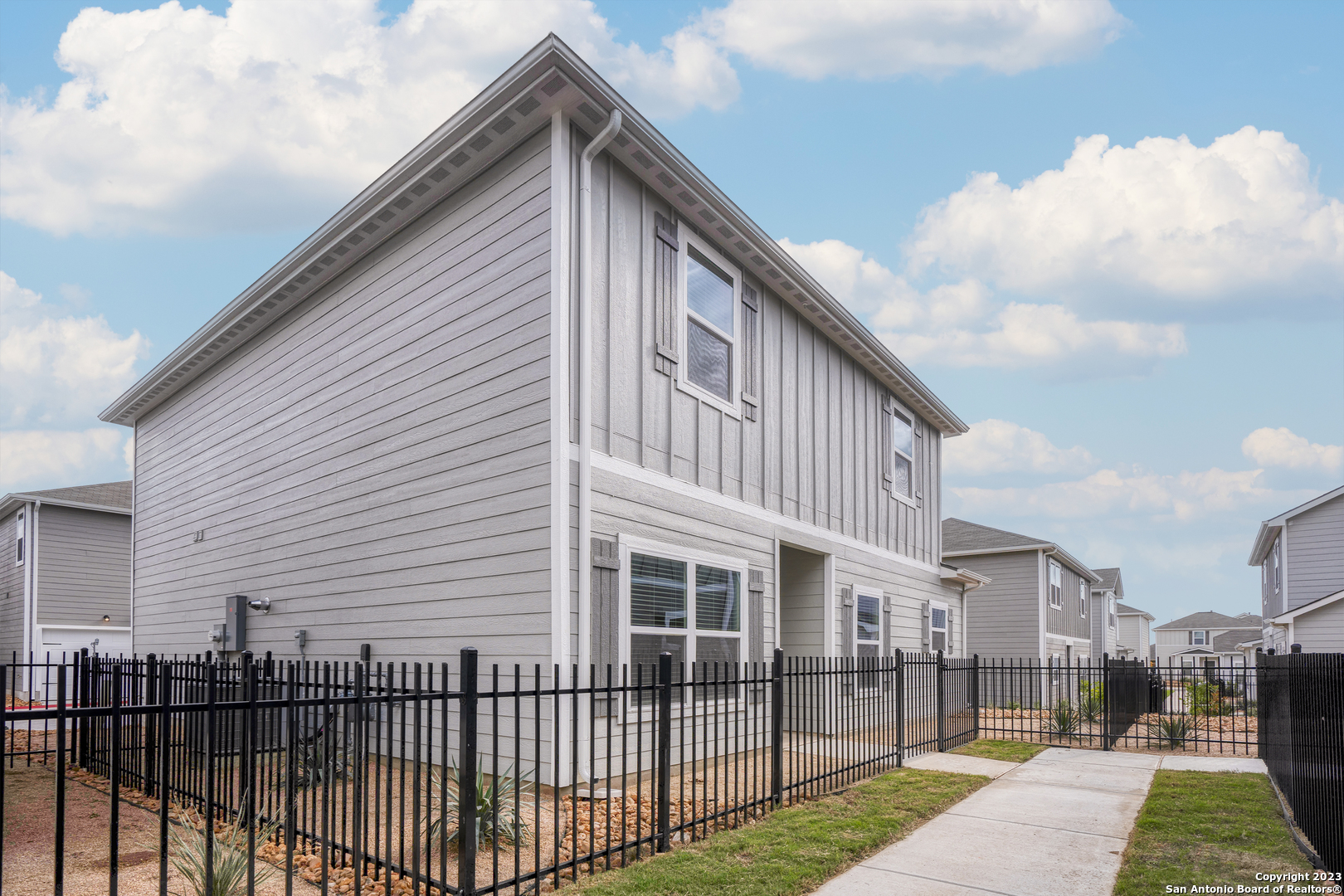 a front view of a house with a yard