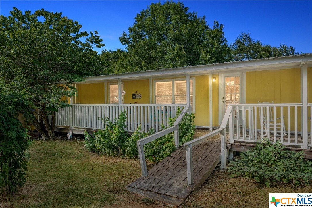 a view of a small deck with a small yard