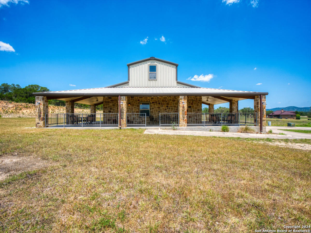 a front view of a building with a garden