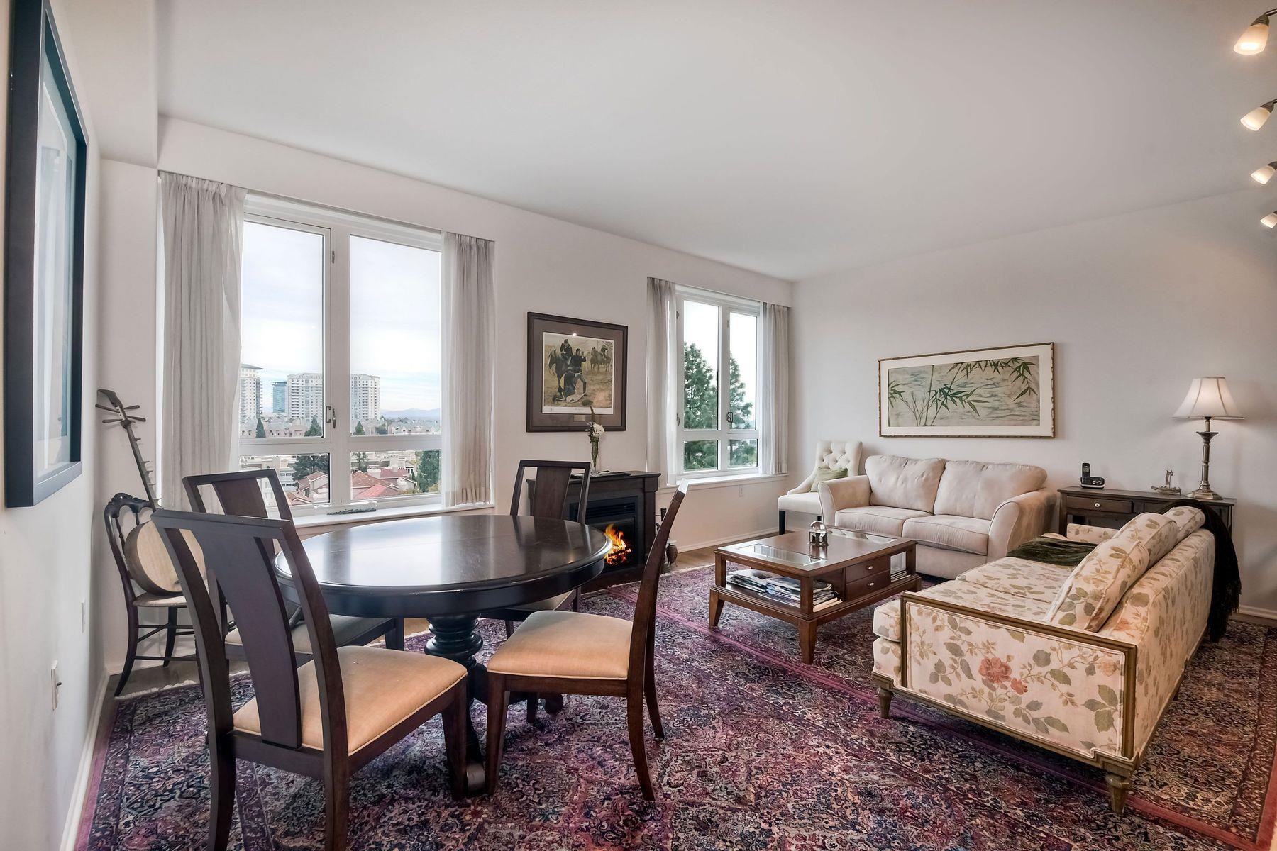 a dining room with furniture a rug and a window