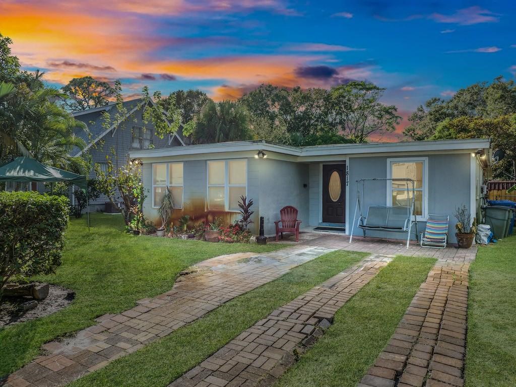 a front view of a house with garden